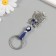 A keychain from the evil eye "owl on a branch" 3.3x7 cm