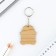 A wooden key keychain "on chil", 4.3 x 5.1 cm