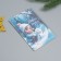 Growing postcard "Happy New Year!" 10*15 cm