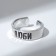 A ring with the inscription "love", the color is silver, dimensionless