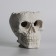 Figure candle in concrete "Crying Skull", black