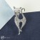 Brooch "Cat" elegant with a bow, white color in silver