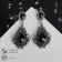 Earrings with rhinestones "Extraordinary" openwork, black color in black silver