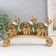 Polystone souvenir "Three elephants on the arc - Popon with red -green" 24x5x15 cm