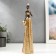 Polystone souvenir "African with a jug in a golden outfit" 33x9x8 cm