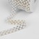 Rhinestones and beads are thermoclayes, width - 15 mm, 4.5 ± 0.5 m, silver color
