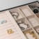 A decoration stand for 9 cells and 12 strips for rings, phlock, 35 × 24 × 3 cm, gray-beige color