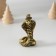 Polystone souvenir "Cobra in the cylinder" Black-gold 3.6x6 cm