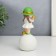 Souvenir Polystone "Baby in a green hat, with a gold bubble on the ball" 16x7x7 cm
