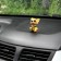 Dog on a car panel shocking his head, mini, spaniel