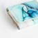 Women's wallet on the button, green color