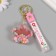 A keychain plastic with a carbine, a strap "Flower with balls" Water with decor 6x6x2 cm