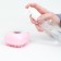 Brush for washing and massage of animals, with a shampoo container, pink