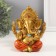 Souvenir Polystone for bronze "Ganesha, in orange haremasses" 10x10x12.5 cm