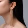 Hanging earrings with Hollywood rhinestones, 8 rows, white color in gold, 12 cm