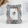 Photo frame "curls" 10x15cm/22.5x17cm, steel with postponement