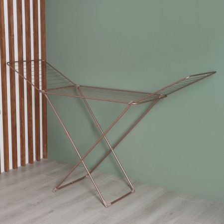 Sushilka for linen is floor folding, working length 20 m, height from the floor 95 cm, width 54 cm, color pink gold