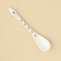 A spoon of souvenir “Happiness lives in the kitchen”, ceramics, 2.5 x 12.5 cm.