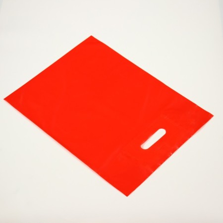 Polyethylene package with a cut handle, red 30-40 cm, 70 μm-1