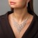 Set 2 objects: earrings, necklaces of “sparks” brushes, white color in silver, 30 cm