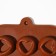 Form for chocolate of the share "Heart", silicone, 23.2 × 12 × 1 cm, 15 cells (d = 3.3 cm), brown color