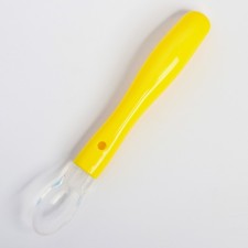 A spoon for nursery for feeding silicone, from 5 months, yellow color