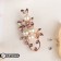 Brooch "Pearl branch" with dew, white-purple color in pink gold