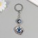 Keychain from the evil eye Metal "petal" 3x3.5 cm