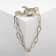 Brooch "Chain" with hooks, white color in gold