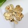 Brooch "Clover" is four-leafed with a rhinestone, the color is white-green in gold
