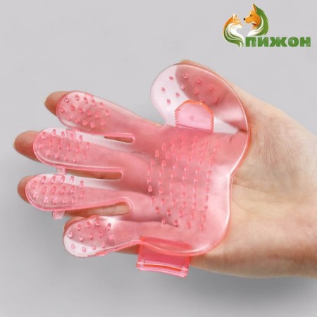 Rubber massage brush on hand, pink