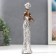 Polystone souvenir "African in silver. Tortard with a pearl with a fruit plate" 32x7x9.5 cm