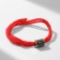 The amulet on the thread "Red thread" rune wisdom, red color with black silver, 30 cm