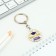 A keychain for graduation "graduate", diam. 3 cm