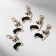Charm "Corgi", black and white in gold