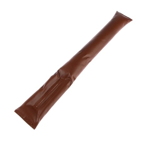 A car pillow between the seat and the armrest, brown