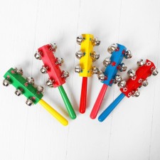 A rattle with bells and a handle, the color of mix