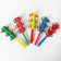A rattle with bells and a handle, the color of mix