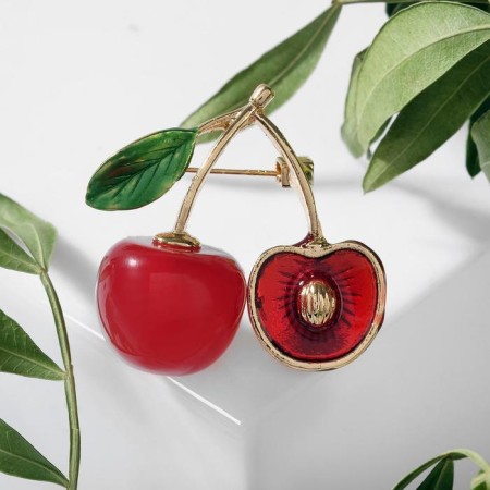Brooch "Cherry" with a bone, the color is red-green in gold