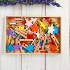 A set of clothespins in a wooden box 