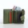 Women's wallet on the button, green color