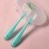 A set of silicone spoons for feeding, 2 pcs., In a container, the color is turquoise