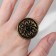 Ring of the "ethnic" patterned circle, black color in black gold, dimensionless