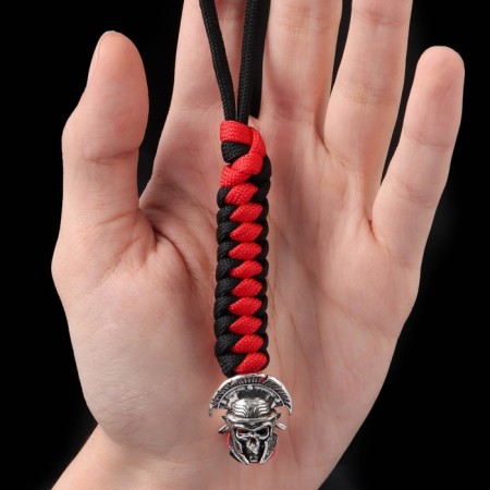 A keychain is a Temlyak for a centurion knife from a paracord, black and red