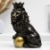 The piggy bank "Leo with a crown and a ball sits" black with gilding, 23cm
