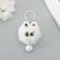 Fluffy on the ring "Star eyes with a bell" white 8.5x6x6 cm