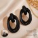 Earrings Metal "Botthega" two ovals, black color