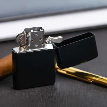The gasoline lighter “Nobody except us”, 5.5 x 3.5 cm.-2