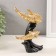 Polystone souvenir "Three dolphins on the wave, with patterns" gold 14x7x17.5 cm