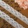 Knitted lace, 27 ± 3 mm × 2.7 ± 0.5 m, white color